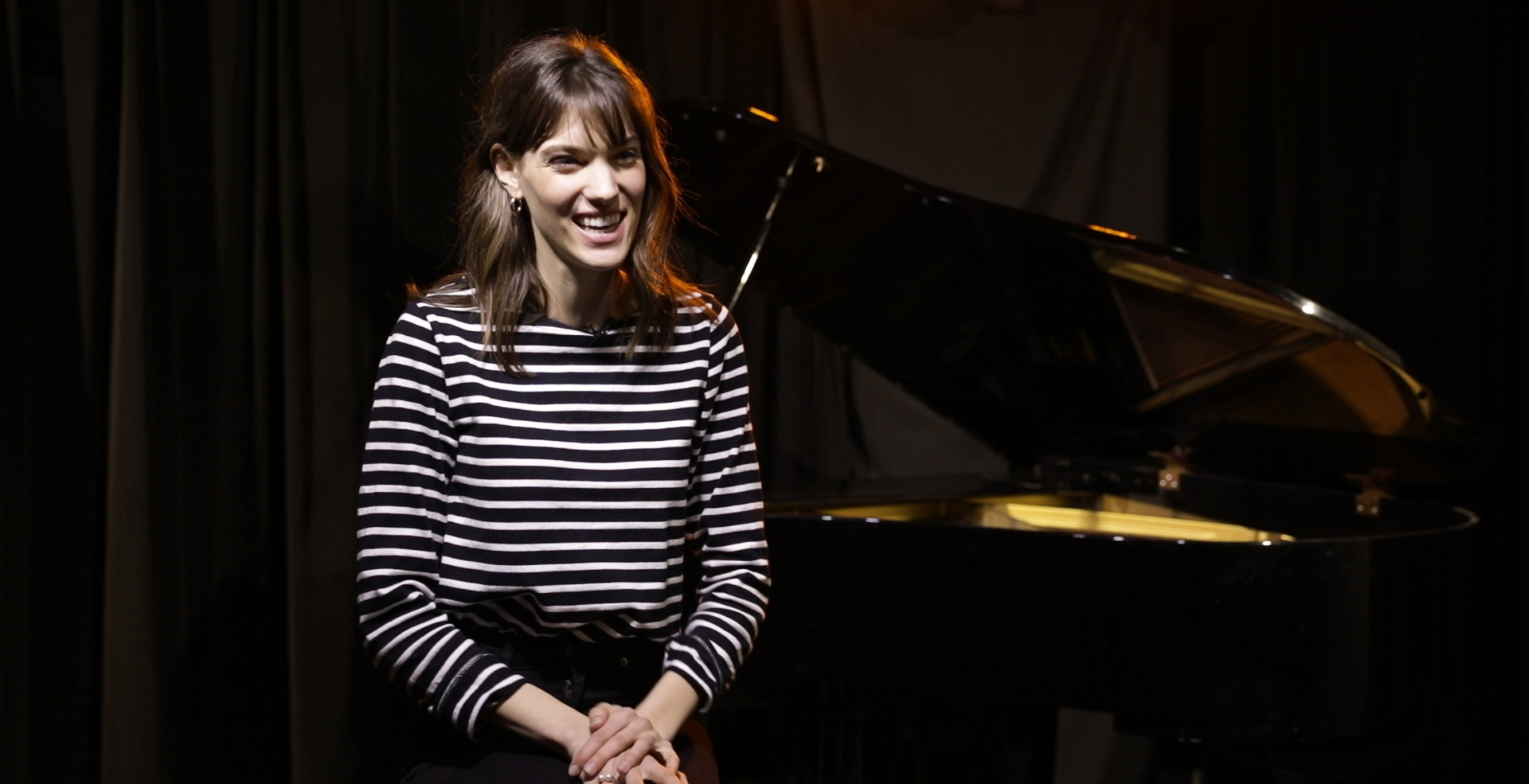 How does Charlotte Cardin write her songs?